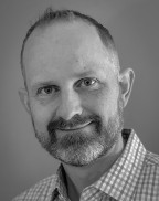 Man smiling in a collared shirt