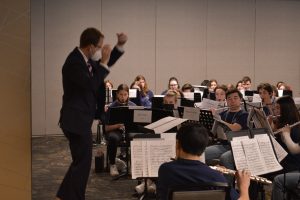 Conductor in front of band