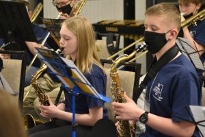 Two students playing saxophone