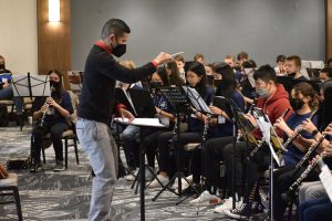 Middle School Conductor Students Playing Instruments